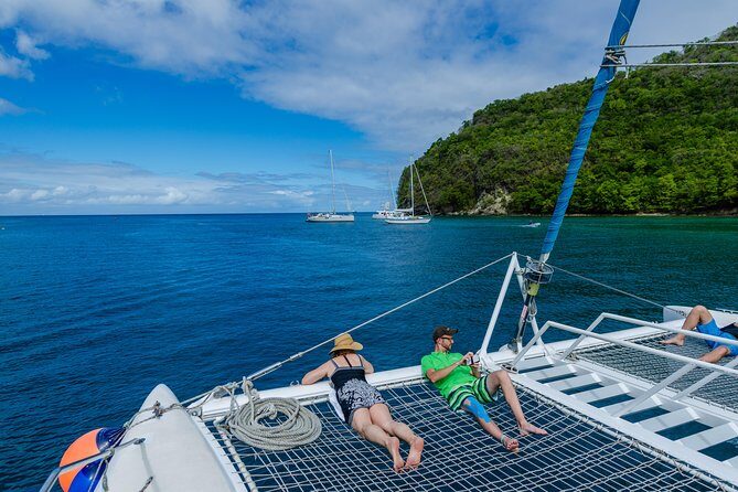 St Lucia Catamaran Day Sailing and Sightseeing Tour - Onboard vibe: crew energy, music, and drink setup